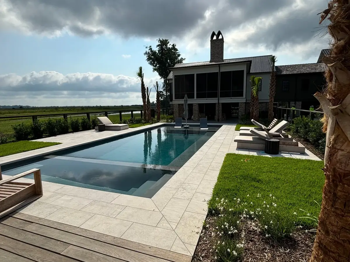 Pool and patio integrated with lawn and layered planting
