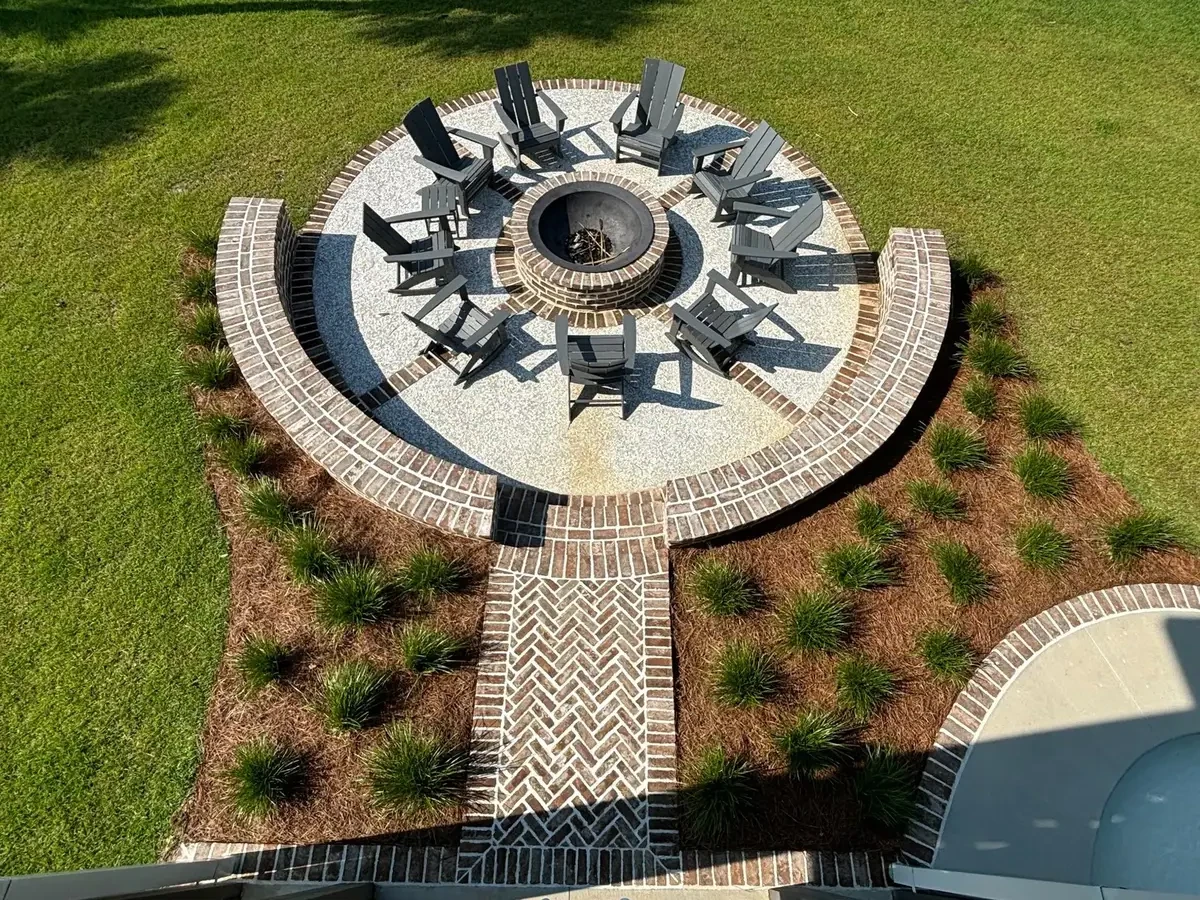 Aerial view of a fire pit and surrounding landscape, rotated for landscape viewing